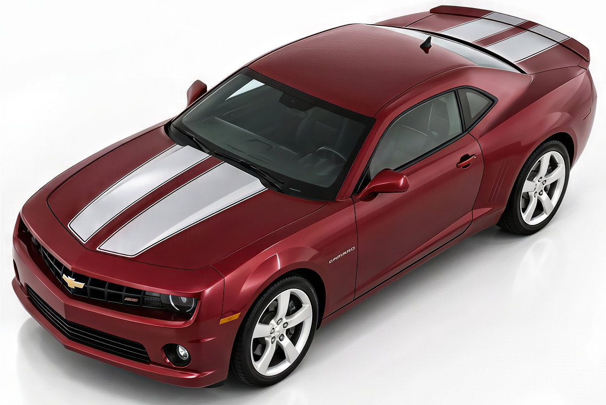Red Chevy Camaro with silver racing stripes on the hood and trunk on a white background
